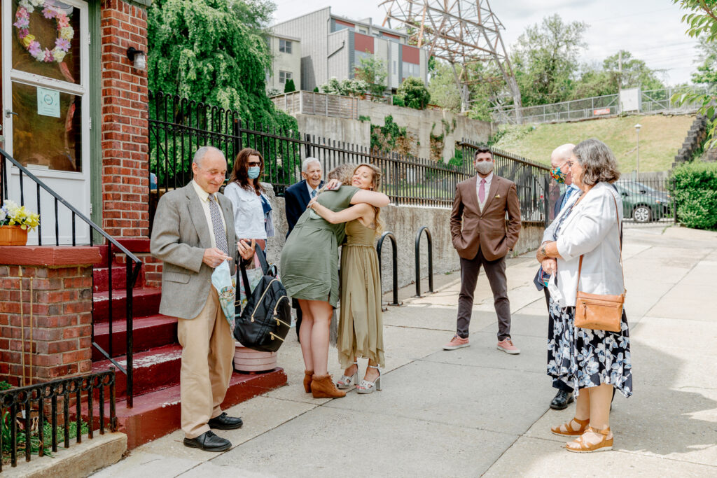 Guests greet each other before a small church wedding in Philly