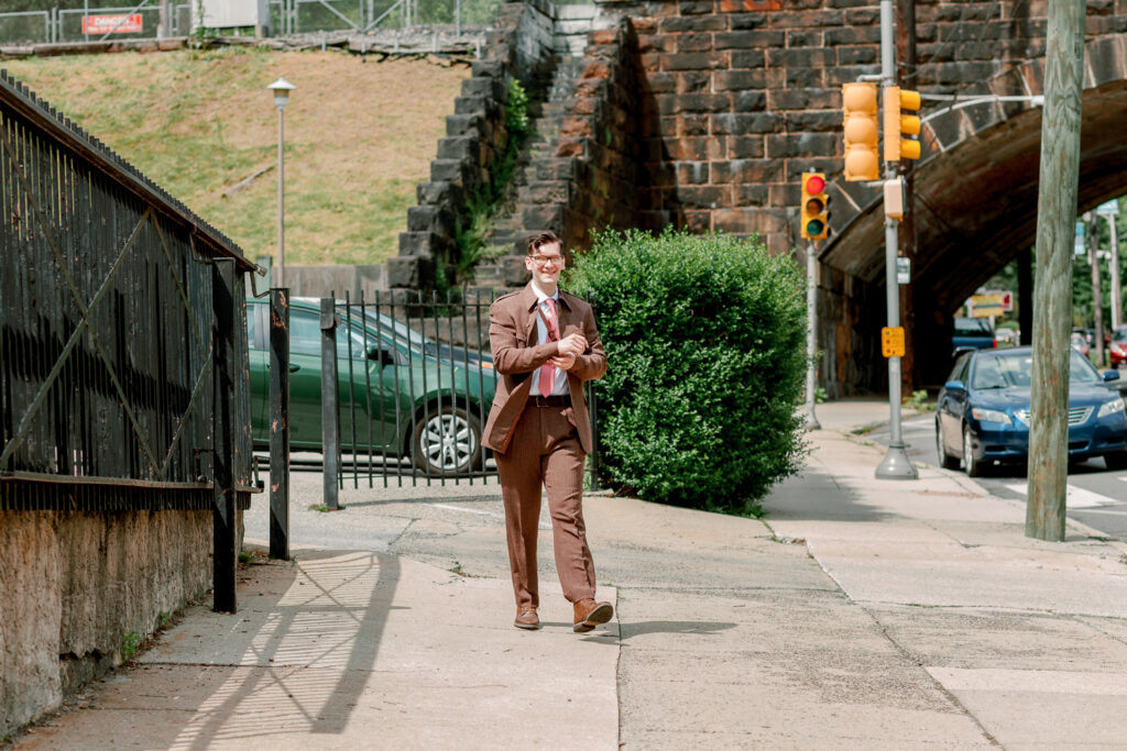 Groom walking to the church before an intimate spring wedding in Philadelphia