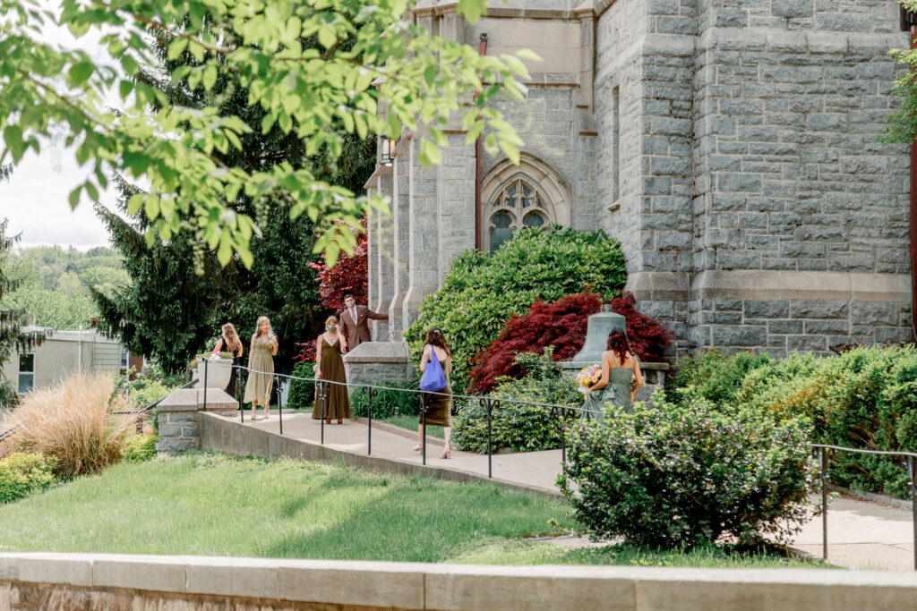 Bridesmaids arriving at St. Bridget's Church in East Falls before a intimate church ceremony by Vay Photo