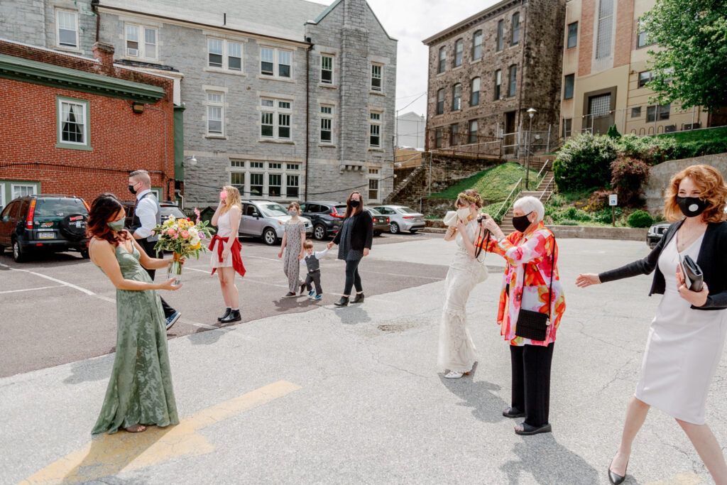 Bride outside of the church on a spring wedding day in Philadelphia by Vay Photo