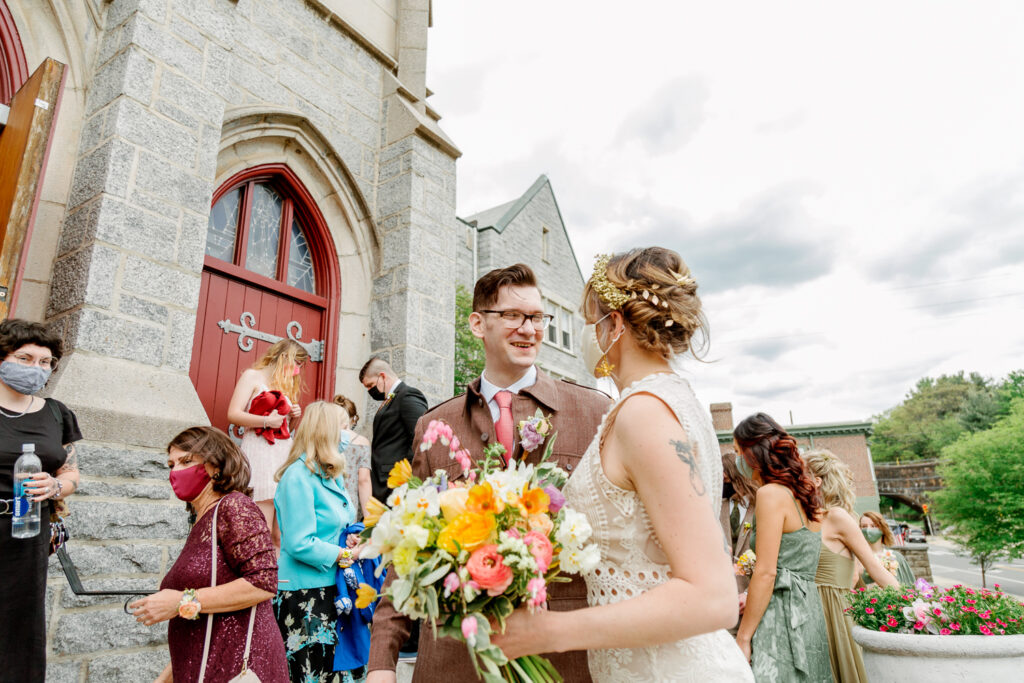 Bride and groom outside the church after an intimate wedding ceremony by Philadelphia wedding photographer Vay Photo