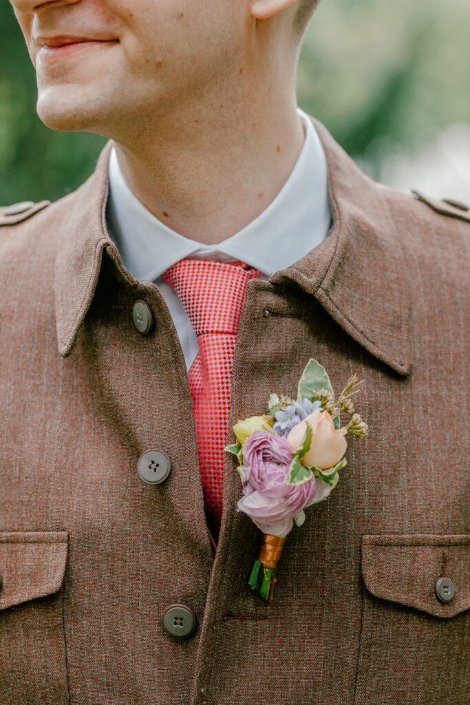 Spring boutonniere on a groom's brown suit for an intimate wedding in Philadelphia