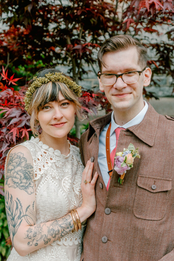 Bride and groom facing the camera on their spring wedding day by Pennsylvania wedding photographer Vay Photo