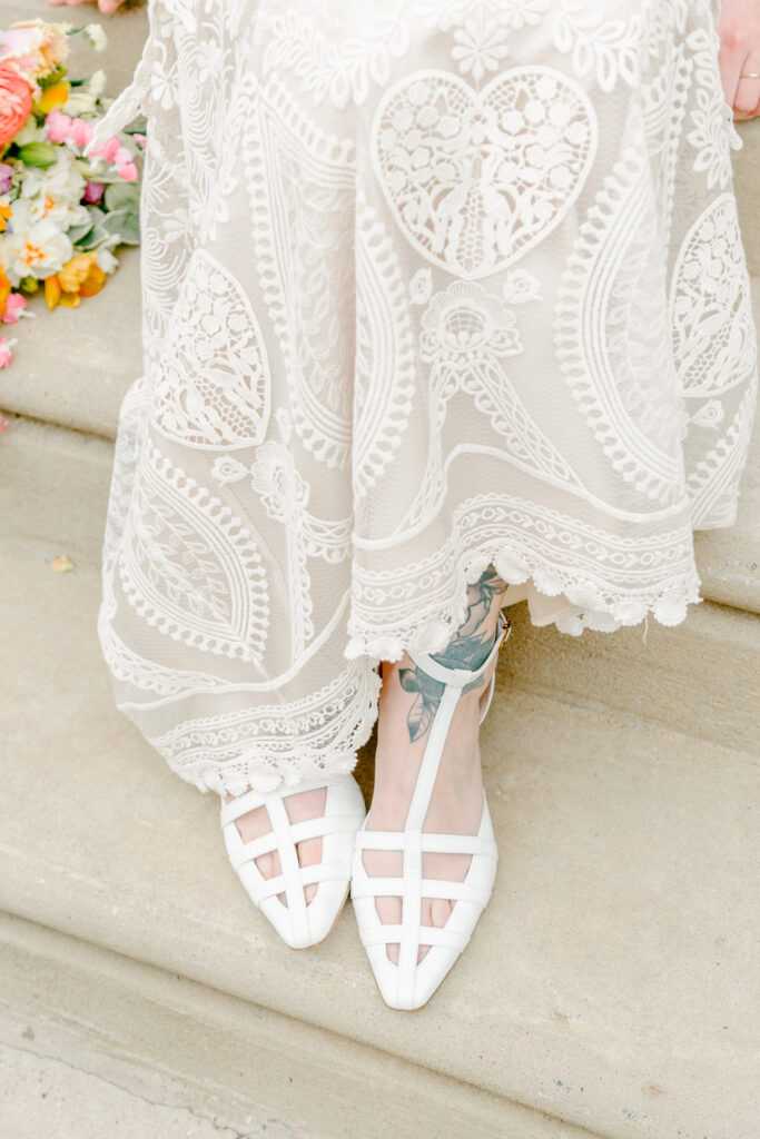 Detail of a bride's embroidered spring wedding dress