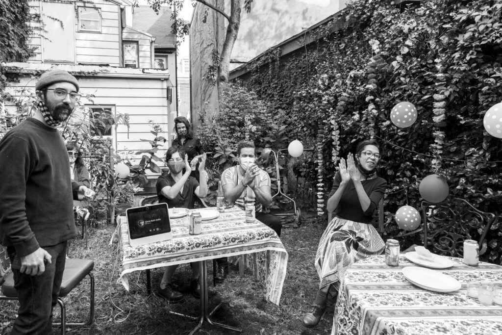 Wedding guests celebrating the marriage during a small backyard wedding in Philly