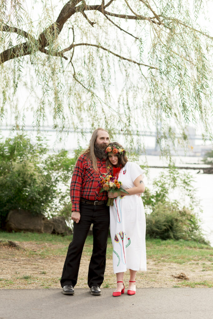 Bride and groom under a willow tree in Philadelphia by wedding photographer Vay Photo